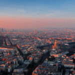 Paris skyline and the Eiffel Tower during sunset.