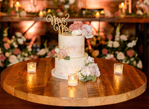 Wedding cake before the ceremony with Mr. and Mrs. on the top.